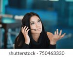 Small photo of infelicitous unhappy customer service girl, confused support person, call center, employer with headphone, latino american, spanish woman trying to explain