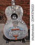 Small photo of Feb. 21, 2022: Blind Willie McTell style guitar arrayed around the Thomson Georgia train station. Blind Willie McTell was a blues and ragtime singer and guitarist. McTell was born blind in one eye.