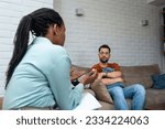 Small photo of Young depressed man crying talking to mental health counselor during a session in the office. Stressed male at psychotherapy after divorce having emotional damage issue. Relationship difficulties.