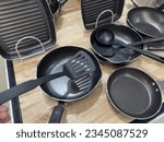 Small photo of Coated aluminum cookware set, deep frying pan, grill pan and nylon ladle, inside coated with non-slip Teflon Classic coating to prevent food from sticking to the pan.