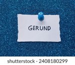 Small photo of Gerund writing on a blue background.
