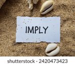 Small photo of Imply writting on beach sand background.