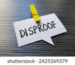 Small photo of Disproof writting on table background.