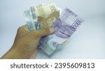 Small photo of Indonesian national currencies. 2,000, 5,000, 10,000 idr. 2016 emission version. Published on December 19, 2016 by the Indonesian bank. Isolated in the white background