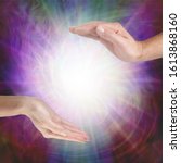 Small photo of Together our healing energies combine to create a powerful influence - male hand opposite female hand with a white light orb in between against a multicoloured flowing energy field background with cop