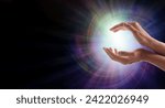 Small photo of Sending Vortex Healing Energy Concept- female cupped hands with a beautiful white star burst orb against a multicoloured energy vortex graduated to black background and copy space for spiritual messa