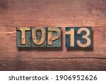 Small photo of top thirteen combined on vintage varnished wooden surface