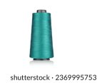 Small photo of spool of industrial threads blue colors, texture of threads on a white background close-up