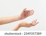 Small photo of A woman's hand gesture separated against a white background. High-definition studio shooting