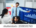 Small photo of Businessman deliver business presentation with financial report data analysis or market trend show on big TV screen for strategic planing in meeting room for company future direction. Meticulous