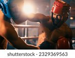 Small photo of Two athletic and muscular body boxers with safety helmet or boxing head guard face off in fierce boxing match. Boxing fighter competitor fighting in the boxing ring. Impetus