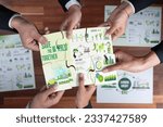 Small photo of Top view cohesive group of business people forming jigsaw puzzle pieces in environmental awareness symbol as eco corporate responsibility as sustainable solution for greener Earth. Quaint