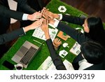 Small photo of Green business community celebrate by happy business people high five after made successful environmental plan and integration of eco-regulation in corporate. Quaint