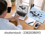 Small photo of Car design engineer analyze car prototype for automobile business at home office. Automotive engineering designer carefully analyze, finding flaws and improvement for car design with laptop Synchronos