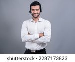 Small photo of Male call center operator wearing headset and formal suit standing confidently on isolated background portrait. Professional smile and service minded for customer service and support. fervent