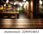 Wooden table blurred background of restaurant of cafe with bokeh. Flawless