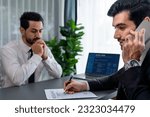 Small photo of Candidate feeling dissatisfied and lose confidence during job interview as interviewer talk on the phone, ignoring and showing disinterest. Negative interview experience for applicant. Fervent