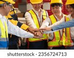 Small photo of Cohesive and united group of factory worker joining hands together in heavy steel industry factory exemplifying teamwork on various industrial engineering profession with team building concept.