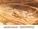 Small photo of Close-up aerial view of the pit of a copper mine at the altiplano of the Atacama Desert in northern Chile