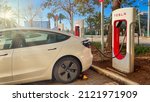 Small photo of Haifa, Israel - February 6, 2022: Tesla cars while charging at Tesla supercharger Station. Tesla Charging point.