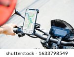 GPS APP screen smartphone installed at motorcycle handle bar for navigator.