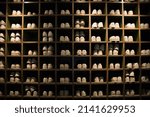 Small photo of bowling shoes organized in cubby shelves bowling alley