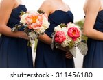 Bridesmaids in Blue with Beautifully Arranged Bouquets