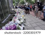 Small photo of HONG KONG, CHINA - SEPTEMBER 10: People place flower tributes for Queen Elizabeth II outside the British Consulate General Hong Kong on September 10, 2022 in Hong Kong, China. Queen Elizabeth II