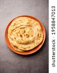 Small photo of Laccha Paratha is a layered Puffed Flatbread with lots of ghee or oil