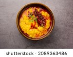 Small photo of Dal tadka is a popular Indian dish where cooked spiced lentils are finished with a tempering made of ghee or oil and spices