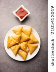Small photo of cocktail mini triangle samosa made using patti or strip, popular home made snack from India