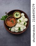 Small photo of Mini idli is the smaller version of soft and spongy round shaped steamed regular rice idli, also known as button and cocktail idly