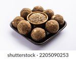 Small photo of Bajra Atta Ladoo or kuler laddoo - Millet Flour Laddu, a popular winter sweet snack food from India