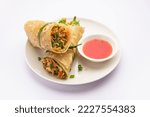 Small photo of Indian chapati veg spring Rolls filled with vegetables and spices, also called franky