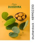 Small photo of Happy Dussehra / Vijayadashami / Ayudh Puja greeting card using apta/Bauhinia racemosa/Bidi leaf and indian sweet pedha or pera