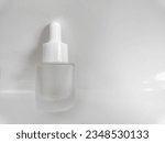 20 ml mini glass serum bottle. blank packaging glass dropper serum bottle isolated on white background with clipping path ready for cosmetic product design mockup. Natural lighting