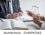 Small photo of Good service cooperation, Consultation of Businesswoman and Male lawyer or judge counselor having team meeting with client, Law and Legal services concept.
