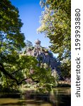 Small photo of Sibyl temple and lake in Buttes-Chaumont Park, Paris, France