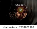 Businessman holding a light chatbot hologram  intelligence AI. Chat GPT chat with AI Artifice intelligent developers by OpenAI generate. 