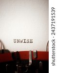 Small photo of Unwise word written with a typewriter.