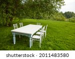 White Table With Chairs Located ...