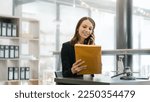 Small photo of Highly skilled female recruiter consulting online on laptop in office meeting white lawyer or financial advisor convene law in video conferencing and audio calls on social media applications.