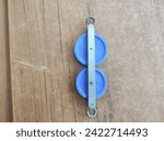 Small photo of fixed pulleys, experimental materials, simple machines, two blue fixed pulleys.