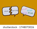 Small photo of a broken speech balloon with the text stuttering written in it and a speech balloon with the words blah blah blah in different colros, on an orange background