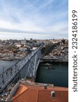 Small photo of The beauty of Porto, Portugal, with the iconic Don Luis Bridge as the protagonist. In the image, the iron bridge extends majestically over the Douro River, connecting the two shores of the city.