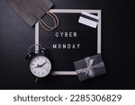 Creative flat lay promotion composition Cyber Monday sale text on board with shopping stuff. Cyber Monday sale mockup promotion advertising. 