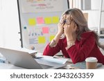 Small photo of Concept Burnout Syndrome. Asian business Woman feels uncomfortable working. Which is caused by stress, accumulated from unsuccessful work And less resting body. Consult a specialist psychiatrist.