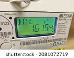 Small photo of London UK, November 25th 2021: A modern smart meter, measuring electricity consumption. LCD display showing current bill. Concept for cost of living, meter reading, high bills, price rise, inflation.