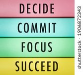 Small photo of Motivational and inspirational quotes - Decide, commit, focus, succeed with wooden background.