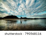 Silhouette Of Fisherman Is...